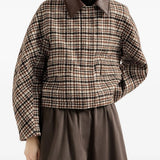 Brown jacket worn by a person, showing the jacket fit