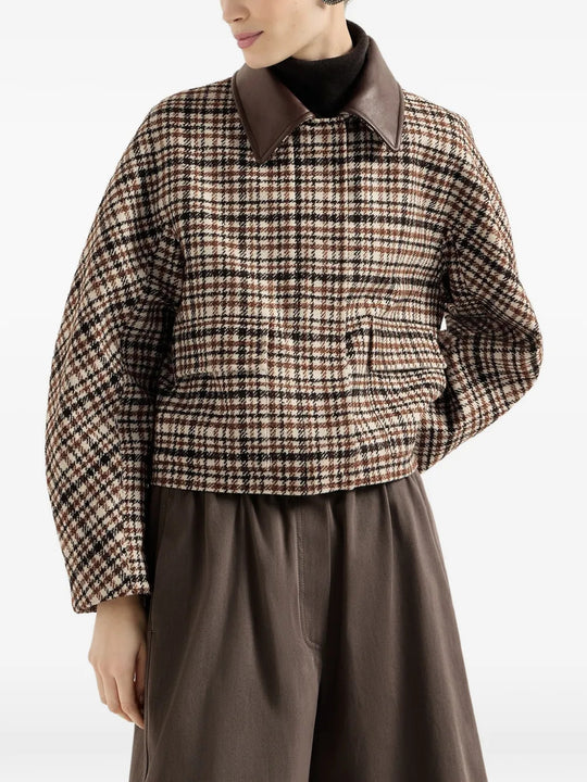 Brown jacket worn by a person, showing the jacket fit