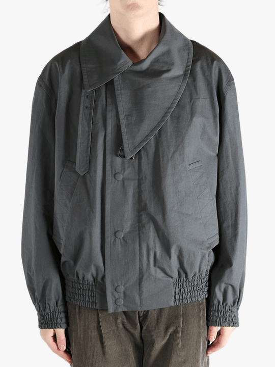 Grey jacket worn by a person, showing the jacket's fit