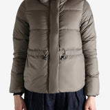 Grey jacket worn by a person, showing the jacket's fit