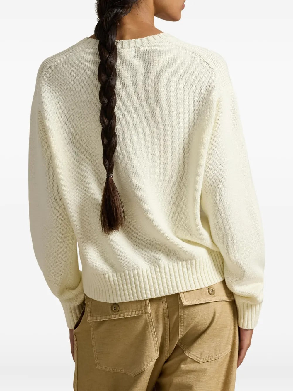 Tan pullove, worn by a person, showing the pullove's fit