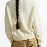 Tan pullove, worn by a person, showing the pullove's fit