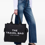 Black bag carried by a person, showing the bag’s fit
