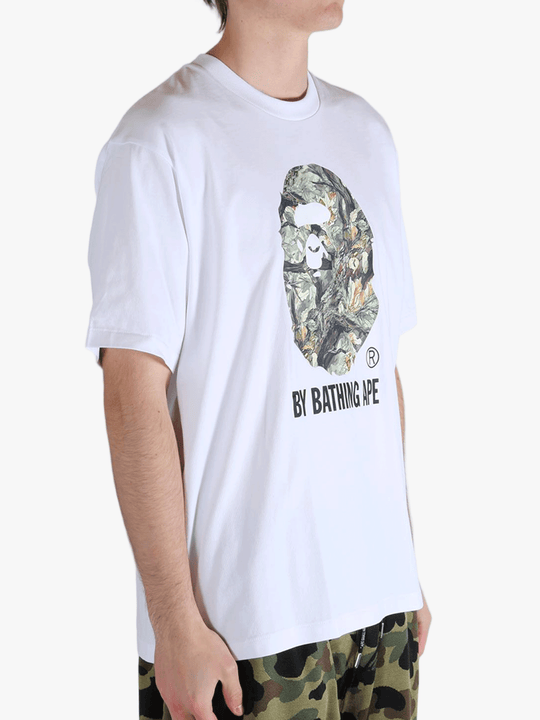 White t-shirt worn by a person, showing the t-shirt's fit