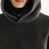 Grey knitwear worn by a person, showing the knitwear fit