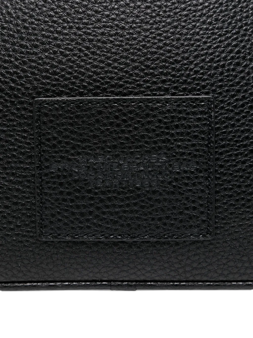 Close up of black bags, showing texture of the split cow leather and polyurethane coating fabric