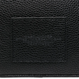Close up of black bags, showing texture of the split cow leather and polyurethane coating fabric