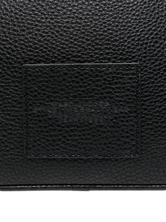 Close up of black bags, showing texture of the split cow leather and polyurethane coating fabric