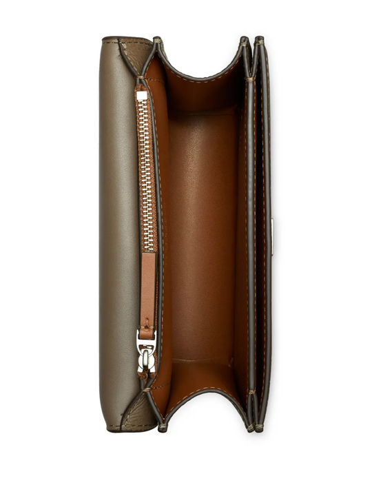 Close up of brown bags, showing texture of the leather fabric