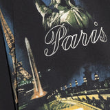 Close up of black t-shirts, showing texture of the cotton fabric