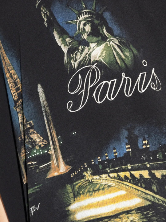 Close up of black t-shirts, showing texture of the cotton fabric