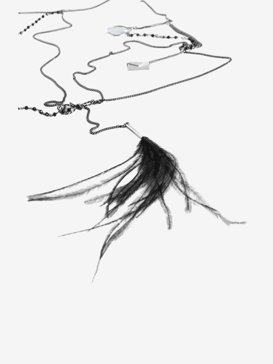 Close up of grey necklace,showing texture of the brass fabric