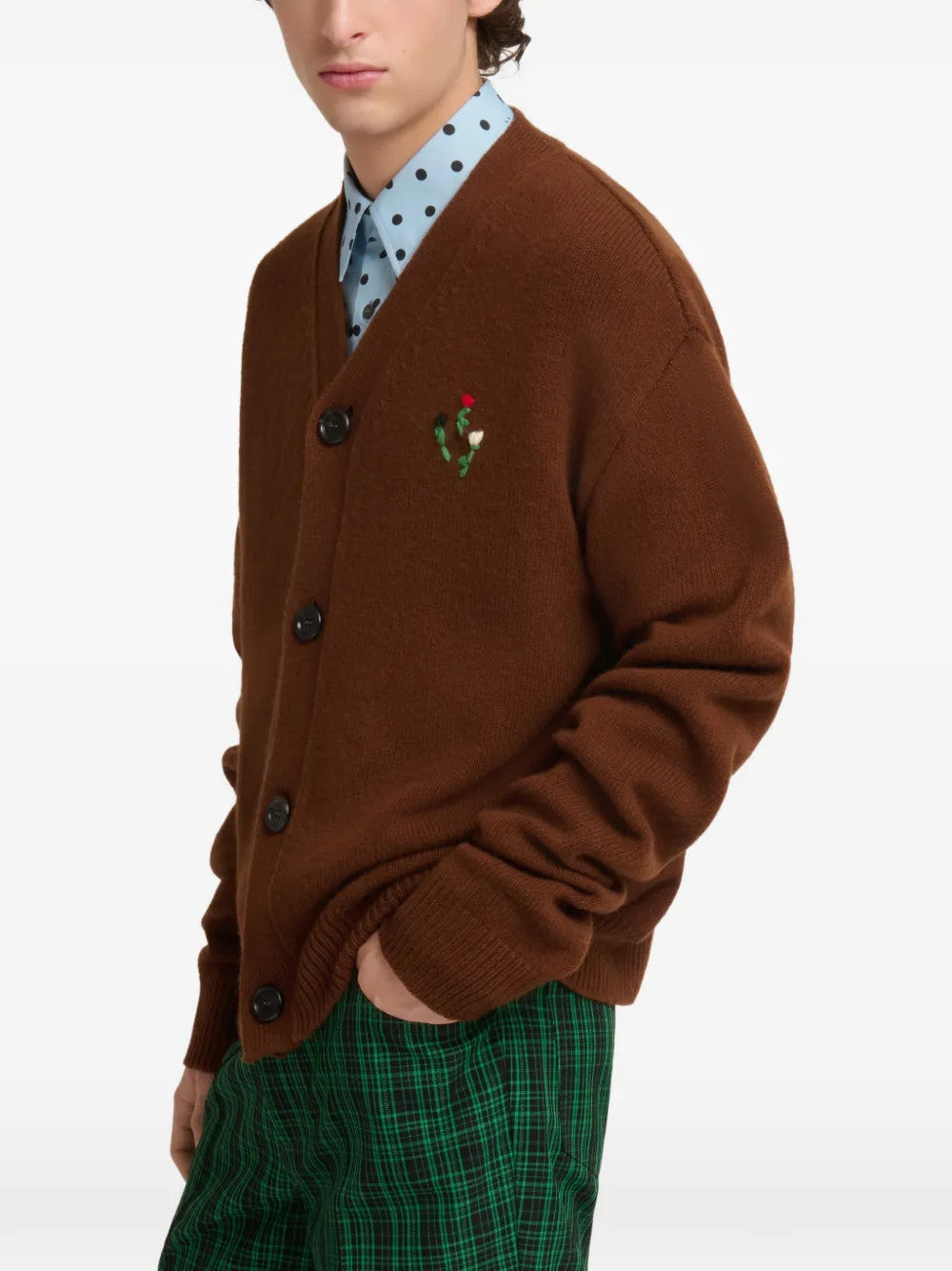 Brown knitwear worn by a person, showing the knitwear fit