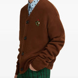 Brown knitwear worn by a person, showing the knitwear fit