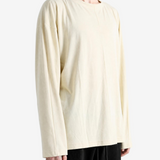 Tan top worn by a person, showing the top fit