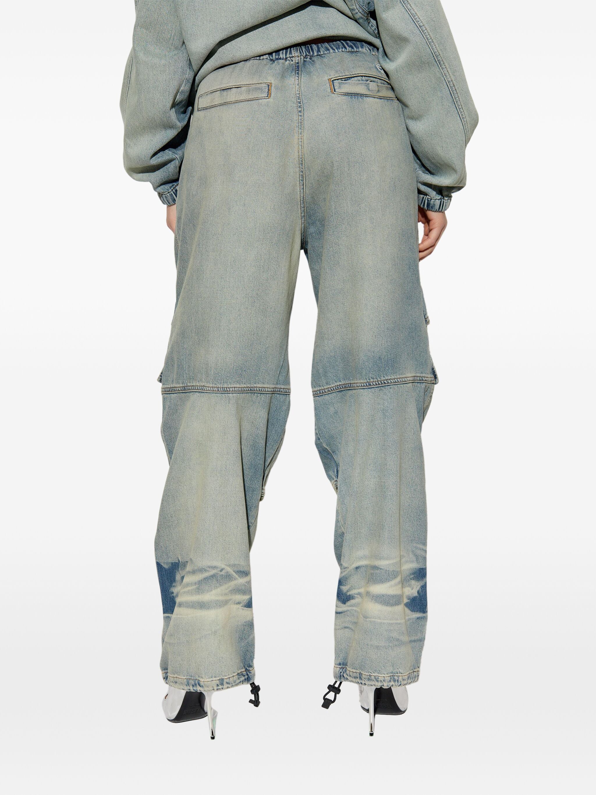 Blue pants worn by a person, showing the pants fit