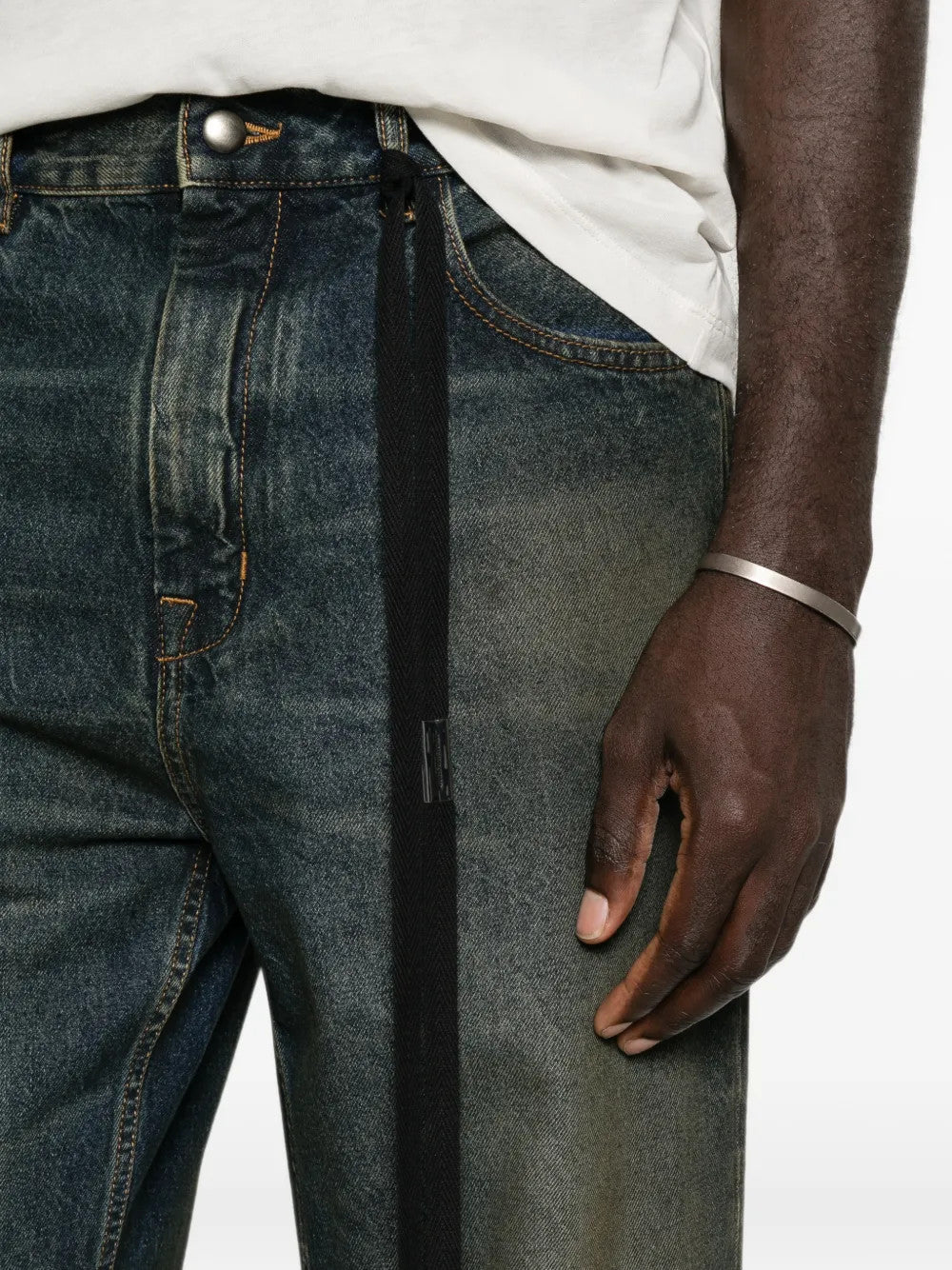 Blue pants worn by a person, showing the pants fit