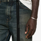 Blue pants worn by a person, showing the pants fit