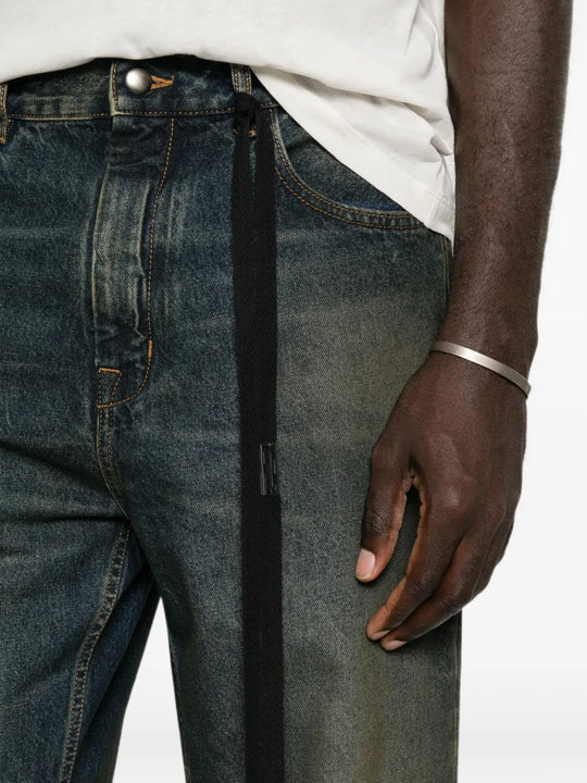 Blue pants worn by a person, showing the pants fit