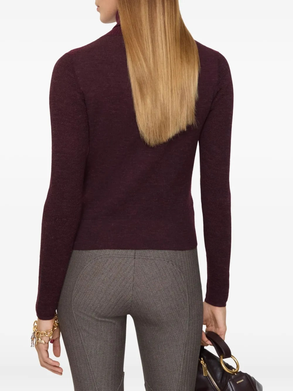 Red knitwear worn by a person, showing the knitwear's fit