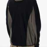 Black jackets worn by a person, showing the jackets fit