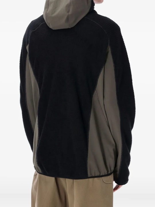 Black jackets worn by a person, showing the jackets fit