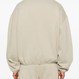 Grey jacket worn by a person, showing the jacket fit