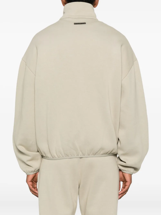 Grey jacket worn by a person, showing the jacket fit