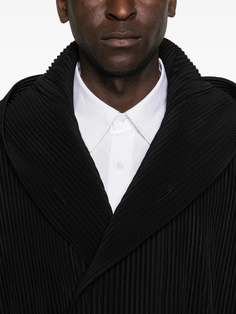 Close up of black blouson, showing texture of the cotton fabric