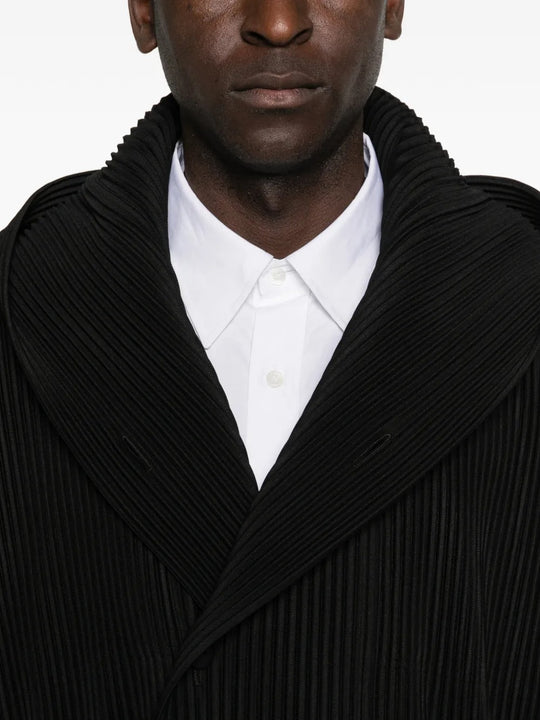 Close up of black blouson, showing texture of the cotton fabric