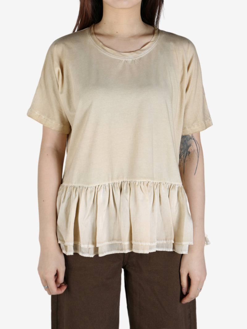 Tan top worn by a person, showing the top's fit