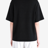 Black t-shirt worn by a person, showing the t-shirt fit