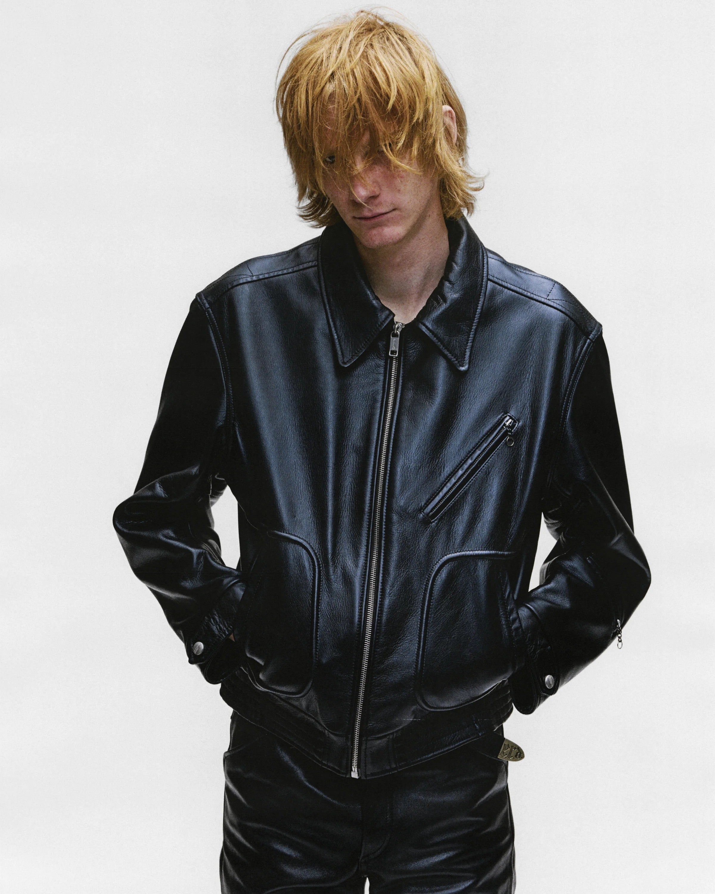 Black jacket worn by a person, showing the jacket's fit