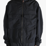Black jackets worn by a person, showing the jackets fit