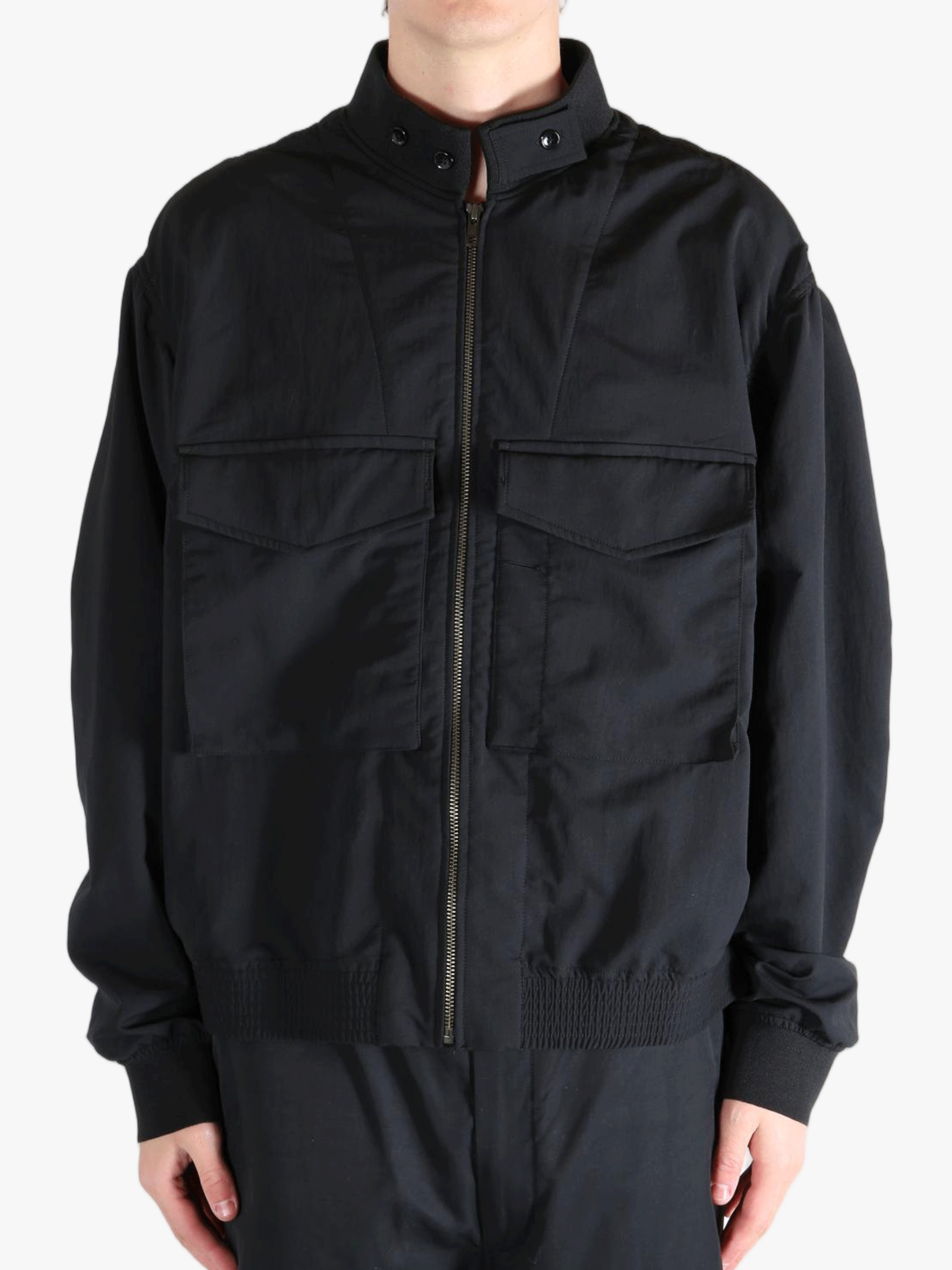Black jackets worn by a person, showing the jackets fit