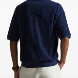 Blue shirt worn by a person, showing the shirt fit