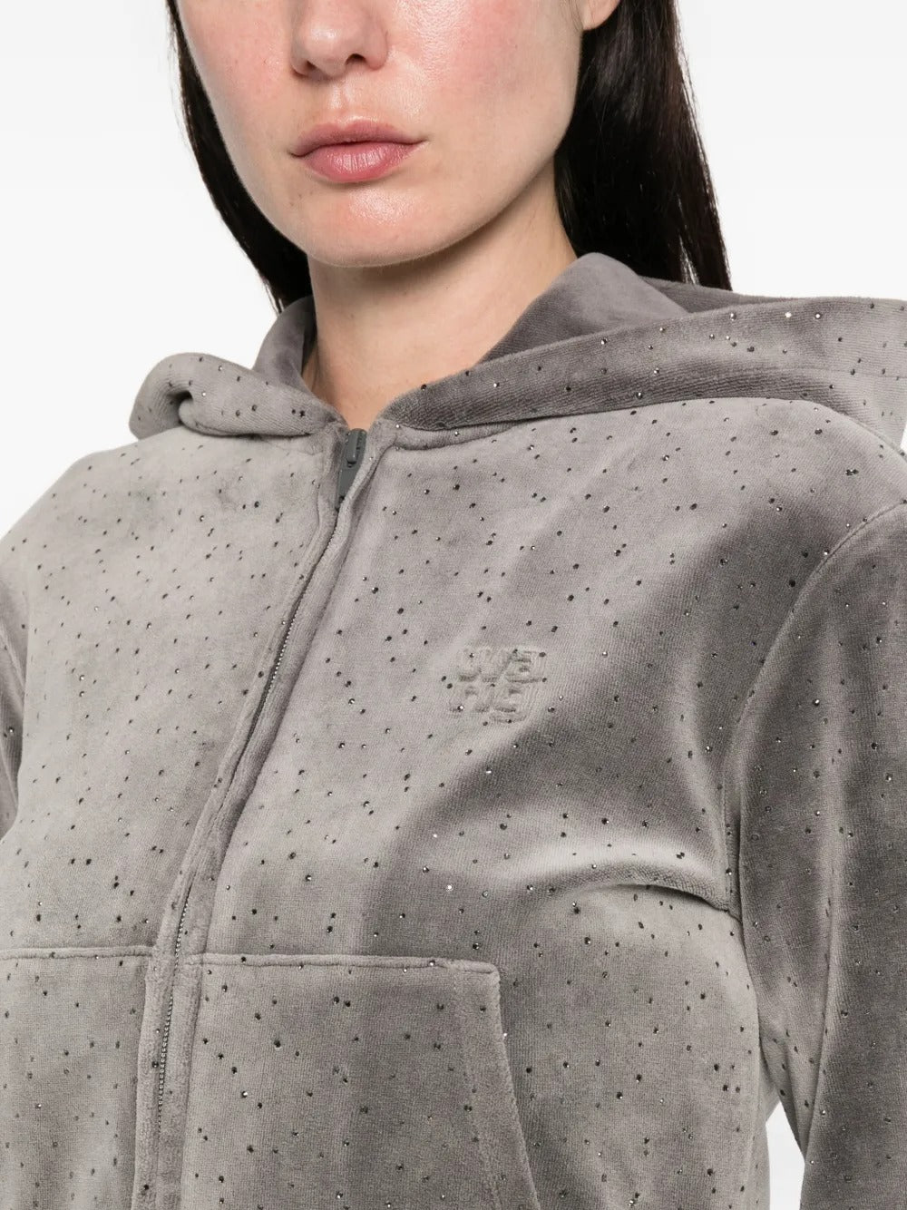 Close up of the grey hoodie, showing texture of the cotton fabric
