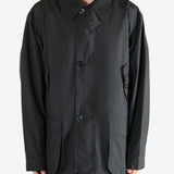 Black jacket worn by a person, showing the jacket's fit