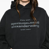 Black hoodie worn by a person, showing the hoodie fit