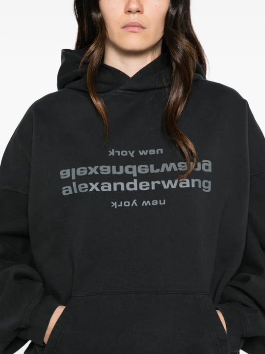 Black hoodie worn by a person, showing the hoodie fit