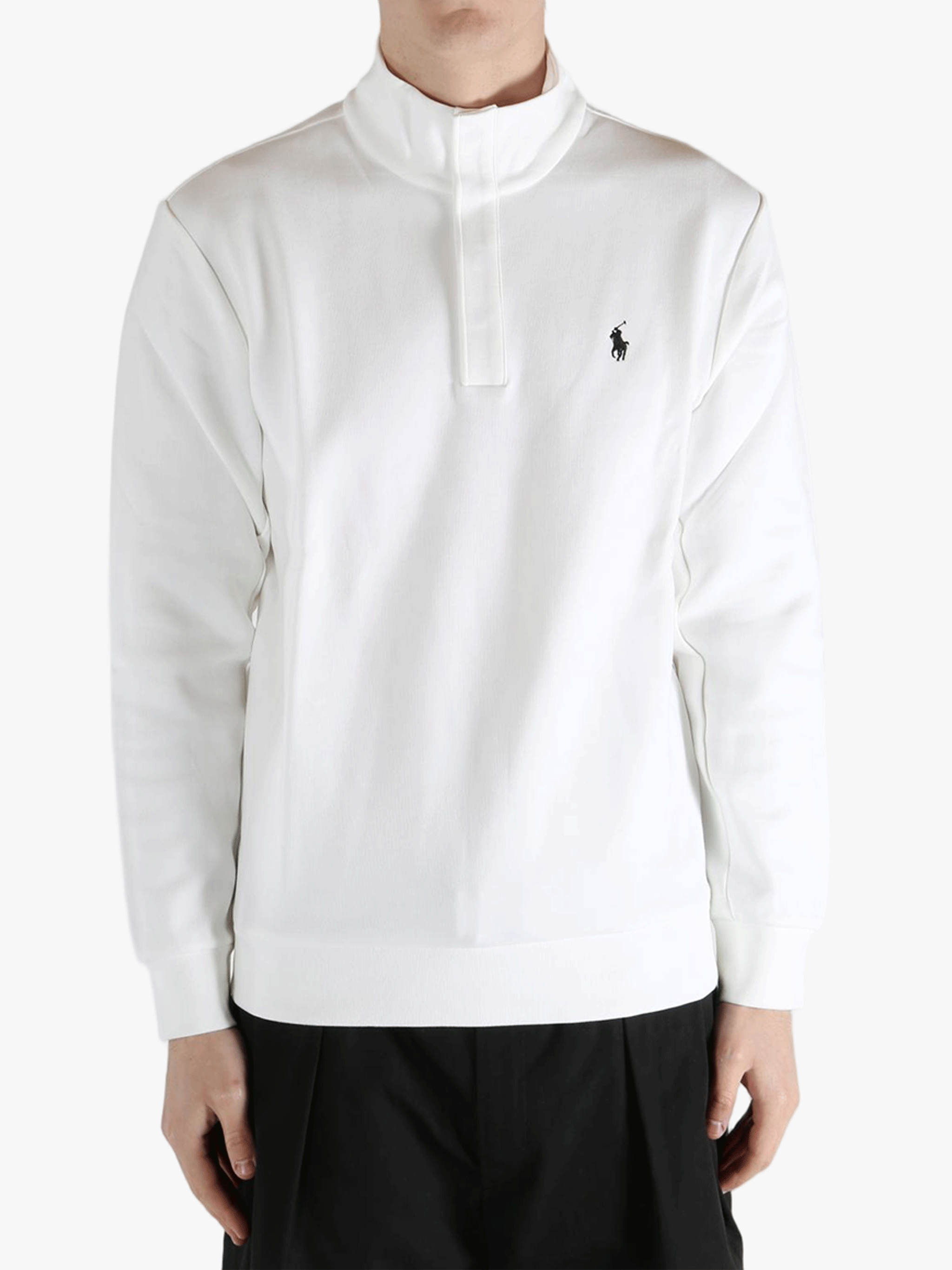 White pullover worn by a person, showing the pullover's fit