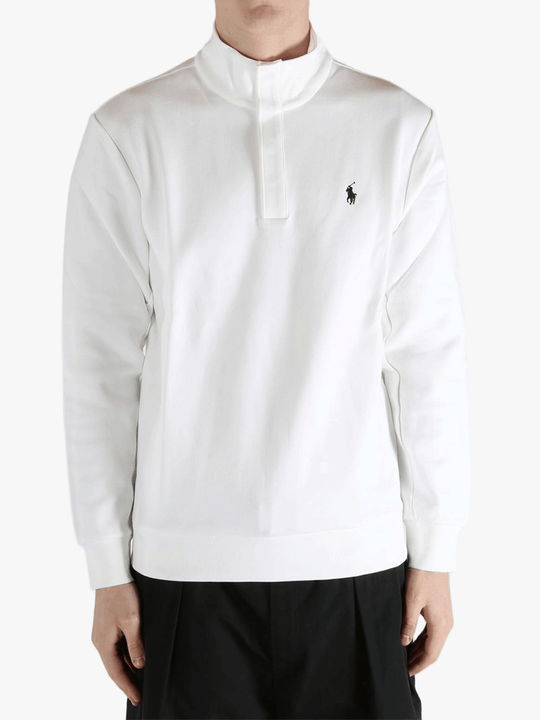 White pullover worn by a person, showing the pullover's fit