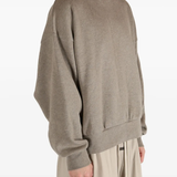 Brown top worn by a person, showing the top's fit