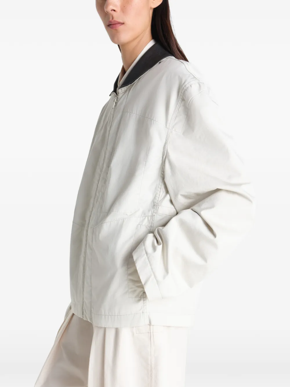 Tan jacket worn by a person, showing the jacket fit