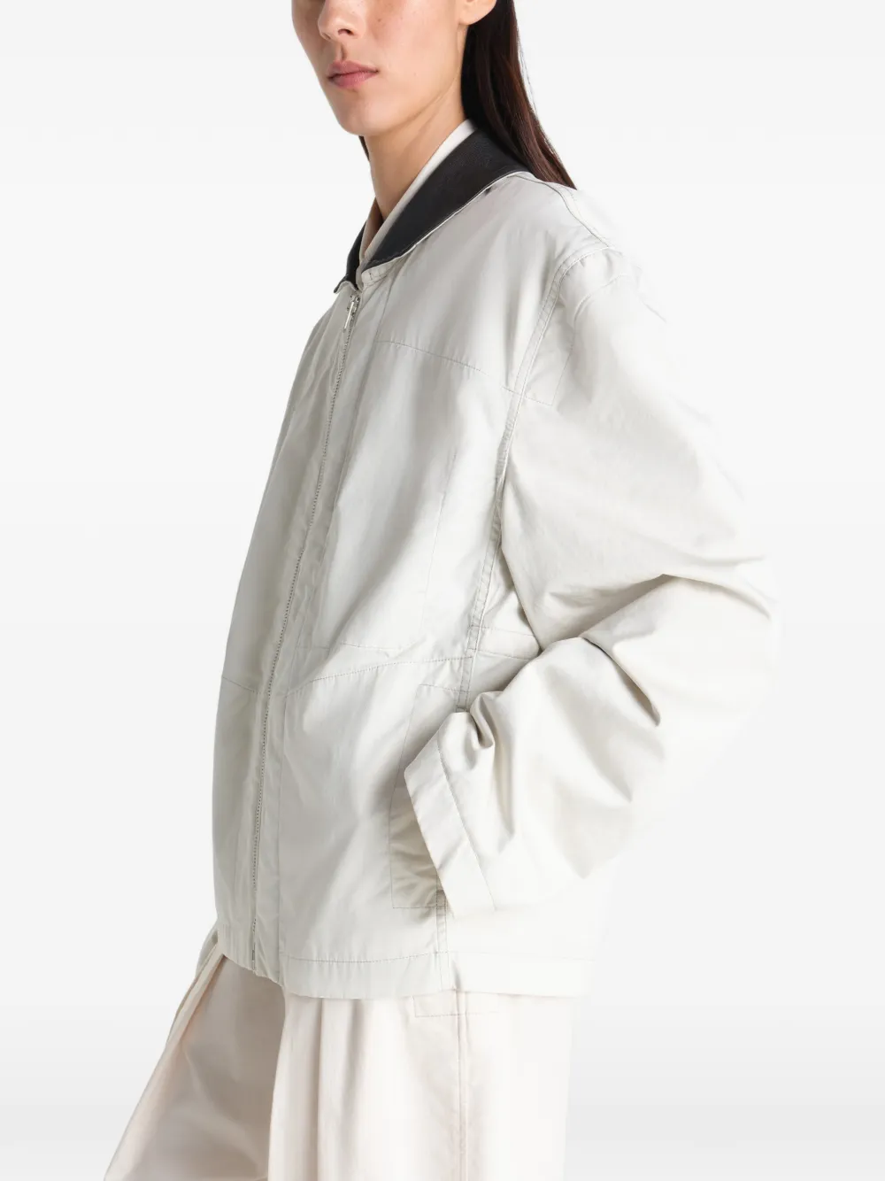 Tan jacket worn by a person, showing the jacket fit