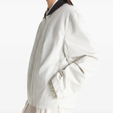 Tan jacket worn by a person, showing the jacket fit
