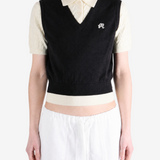 Black shirt worn by a person, showing the shirt fit