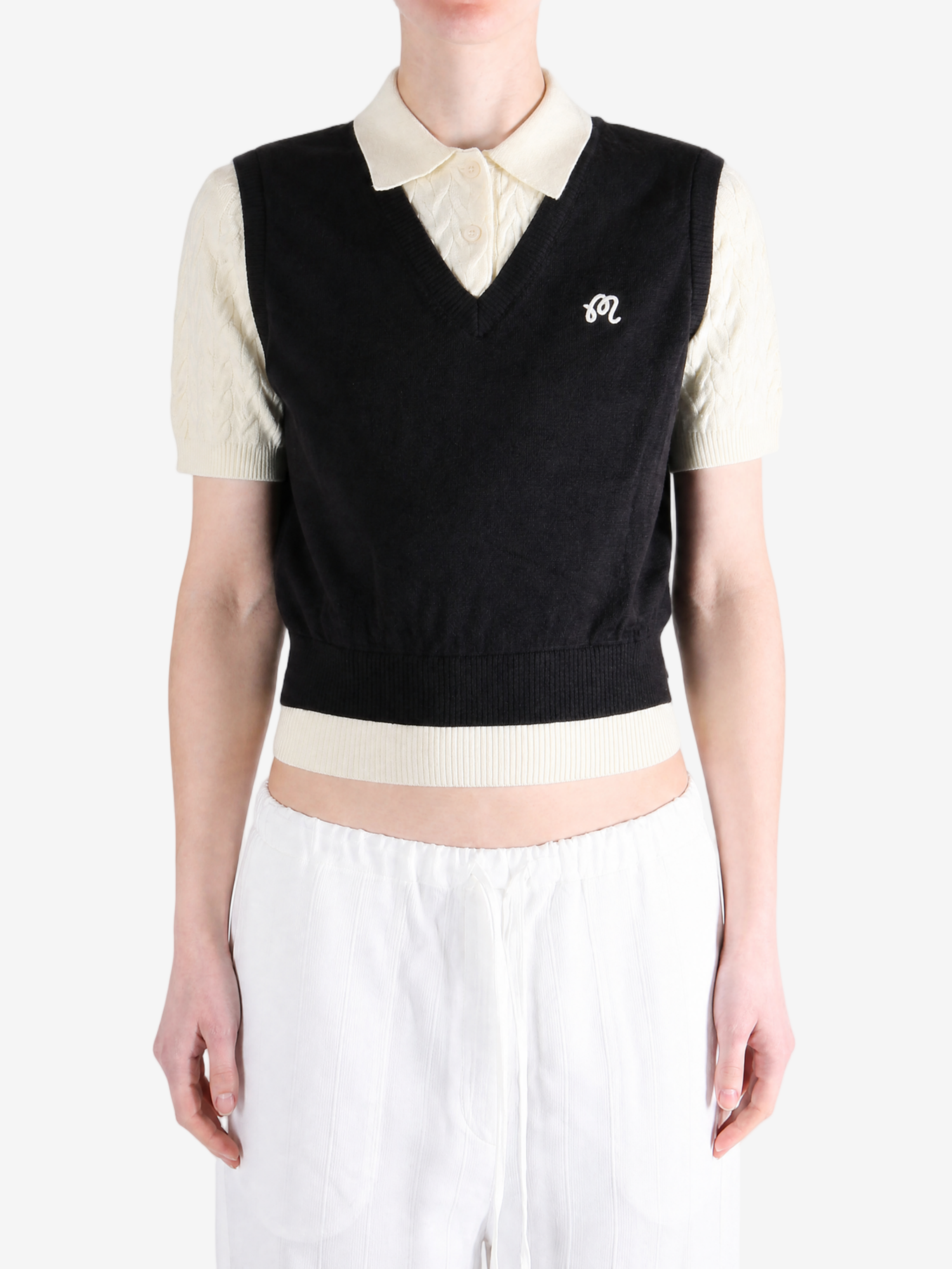 Black shirt worn by a person, showing the shirt fit
