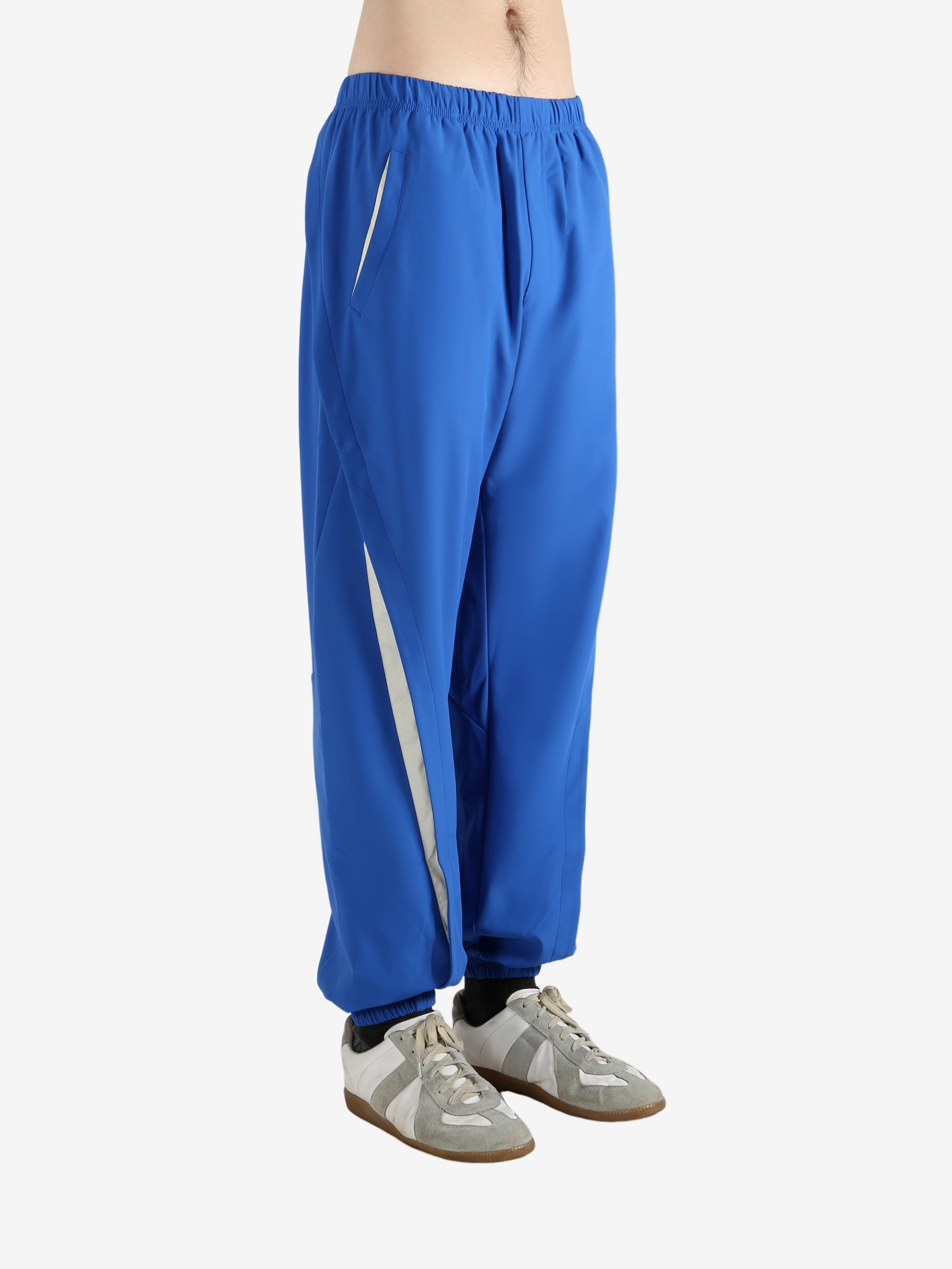 Blue pants worn by a person, showing the pants' fit