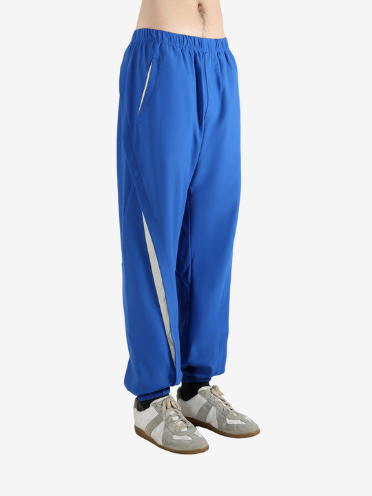 Blue pants worn by a person, showing the pants' fit